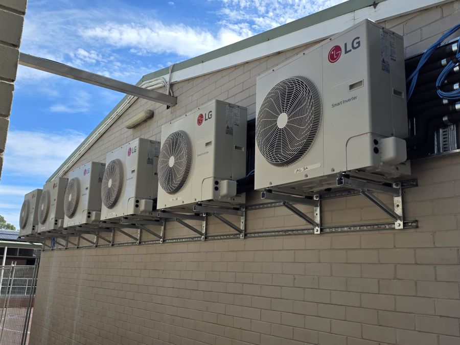 LG outdoor units on a custom wall bracket rail